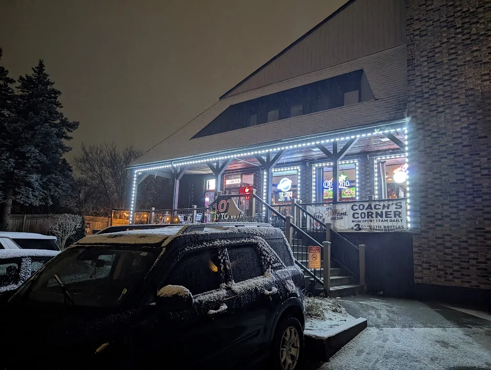 Coach’s Corner sign and illuminated entrance in Willow Springs